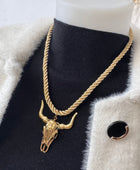 Collier cordelette dorée tête de buffle