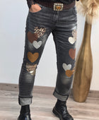 Jeans noir délavé multi patchs cœurs