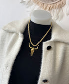 Collier cordelette dorée tête de buffle