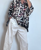 Blouse camélia noire et rose