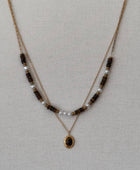Collier double rang doré perles nacrées et pierre œil de tigre acier