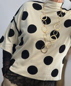 Pull crème pois noirs