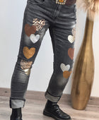 Jeans noir délavé multi patchs cœurs