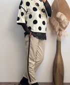 Pull crème pois noirs