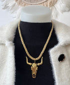 Collier cordelette dorée tête de buffle