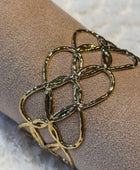 Bracelet manchette cœurs dorés