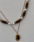 Collier double rang doré perles nacrées et pierre œil de tigre acier