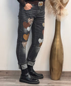Jeans noir délavé multi patchs cœurs