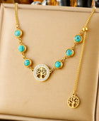 Collier Arbre de Vie Doré – Pierres Turquoises et Pendentifs Symboliques