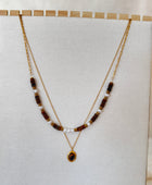 Collier double rang doré perles nacrées et pierre œil de tigre acier