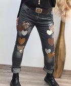 Jeans noir délavé multi patchs cœurs