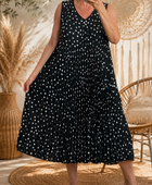 Robe plissée noire à pois